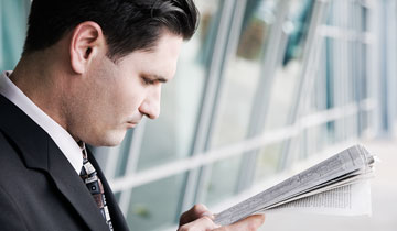 a man looking at a tablet